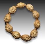 CHINESE CARVED NUT'S BUDDHA BRACELET, QING DYNASTY (1644-1911)