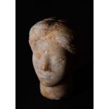 A FINE ROMAN STONE BUST OF A NOBLE WOMAN CIRCA 3RD CENTURY A.D.