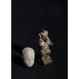 AN EGYPTIAN CLAY HEAD FIGURE OF A PHAROH & A CARVED GRANITE AMULET OF A GOD