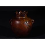 A ROMAN RED JASPER COSMETIC VESSEL IN THE SHAPE OF A POMEGRANATE, CIRCA 1ST-3RD CENTURY A.D.