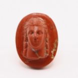 A ROMAN RED JASPER INTAGLIO OF A NOBLE WOMAN, CIRCA 2ND CENTURY A.D. OR LATER