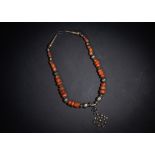 A CORAL & SILVER TRIBAL NECKLACE