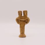 A SYRIAN DOUBLE HEADED TERRACOTTA IDOL CIRCA 3RD-2ND MILLENNIUM B.C.