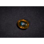 AN AMBER COLOURED GLASS PHOENICIAN FACE BEAD 5TH-4TH CENTURY B.C.