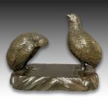 A JAPANESE BRONZE GROUP OF TWO SEATED QUAILS, MEIJI PERIOD, 19TH CENTURY