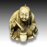 AN IVORY NETSUKE OF A STREET VENDOR, MEIJI PERIOD, 19TH CENTURY