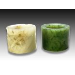 TWO CHINESE RUSSET JADE & SPINACH RINGS, LATE MING, EARLY QING (1644-1911)