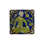 A SAFAVID FIGURAL CUERDA SECA TILE, 18TH CENTURY