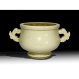 A CHINESE WHITE GLAZED DOUBLE HANDELED CUP