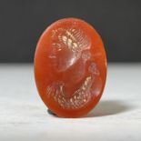 A ROMAN CARNELIAN INTAGLIO, 2ND-3RD CENTURY DEPICTING A RULER