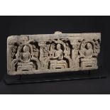 A GREY GHANDARA SCHIST CARVED PANEL WITH SEATED WORSHIPPING BUDDHAS CIRCA 3RD/4TH CENTURY