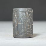 A HEMITATE BABALOYANIAN CYLINDER SEAL IN THE STYLE OF 2ND MILLENNIUM B.C.