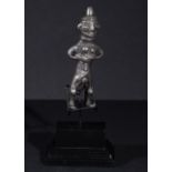 A SOLID SILVER EROTIC FIGURE IMITATING A FERTILITY GODDESS IN THE STYLE OF 1ST MILLENNIUM B.C.