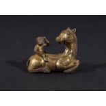 A CHINESE GILT BRONZE SEATED HORSE WITH MONKEY IN THE STYLE OF 400B.C.