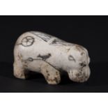 AN EGYPTIAN WHITE GLAZED HIPPOPOTAMUS, NEW KINGDOM PERIOD 1400B.C.