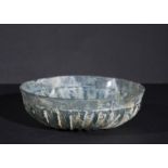 A RIBBED TURQUOISE FLUTED GLASS BOWL, EARLY ROMAN PERIOD, 1ST CENTURY B.C.