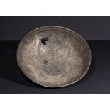 A SILVER REPOUSSE BOWL WITH LOTUS FLOWERS, IMITATING EARLY ACHAEMENID PERIOD OF 300B.C.