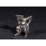 A RARE ANCIENT ROMAN DICE FIGURE IN SILVER DEPICTING A SQUATTING FEMALE GODDESS, 1ST CENTURY A.D.