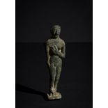 A STANDING NUDE FIGURE OF A FEMALE DEITY EARLY PERIOD, INDUS OR BACTRIA EARLY 1ST MILLENIUM B.C