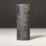 A HEMITATE BABALOYANIAN CYLINDER SEAL INSCRIBED WITH CUNIFORM, 2ND MILLENNIUM B.C