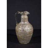 A ROMAN INTACT COLOURLESS GLASS JUG BY ENNION CIRCA 1ST CENTURY A.D.