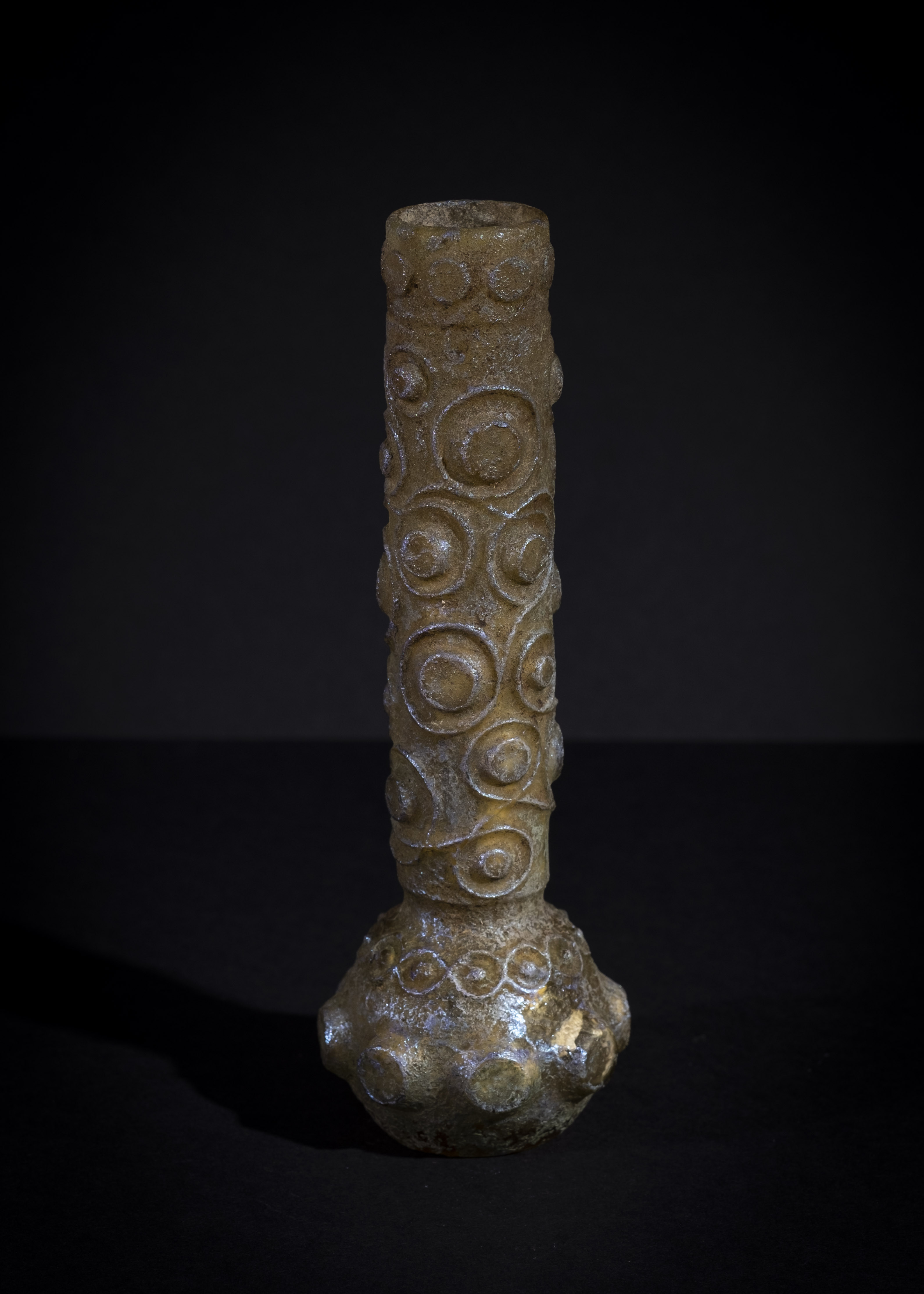 AN ELABORATED ISLAMIC MOULD GLASS BOTTLE