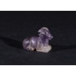 AN AMETHYST SEATED GOAT AMULET IN THE STYLE OF PTOLEMAIC PERIOD