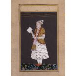 AN INDIAN MINIATURE OF AN OLD NOBLE MAN READING A BOOK, 19TH/20TH CENTURY