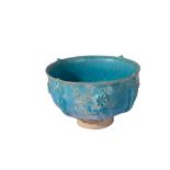 AN INTACT SELJUK TURQUOISE GLAZED LUSTRE POTTERY FOOTED BOWL, 13TH CENTURY