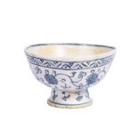 A EARLY FOOTED IZNIK BLUE & WHITE FLORAL BOWL, CIRCA 1520-1530, 16TH CENTURY