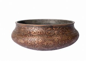 AN EARLY COPPER ENGRAVED QAJAR BASIN WITH CALLIGRAPHY, 18TH/19TH CENTURY