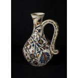 A LARGE KUTAHYA POTTERY FLORAL JUG, OTTOMAN TURKEY, 19TH/20TH CENTURY