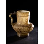A RARE FATIMID CLEAR GLASS LUSTRE HANDLED GLASS JUG, 10TH CENTURY, EGYPT