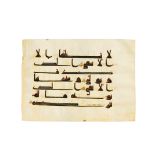 A QUR’AN FOLIO IN KUFIC SCRIPT ON VELLUM, NORTH AFRICA OR NEAR EAST, 9TH CENTURY AD