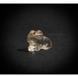 AN EXTREMELY RARE & EARLY MUGHAL ROCK CRYSTAL SEATED LION WITH RUBY EYES, 16TH CENTURY