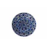 A SAFAVID BLACK, BLUE AND WHITE "KUBACHI" POTTERY DISH PROBABLY TABRIZ, IRAN, EARLY 17TH CENTURY