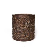A CHINESE CARVED WOOD DRAGON BRUSH POT, PROBABLY ZITAN WOOD, 18TH/19TH CENTURY