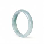 A CHINESE CELADON JADE BANGLE, QING DYNASTY (1644-1911)