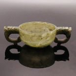 A CHINESE TWIN HANDLE SPINACH JADE CUP, QING DYNASTY (1644-1911)
