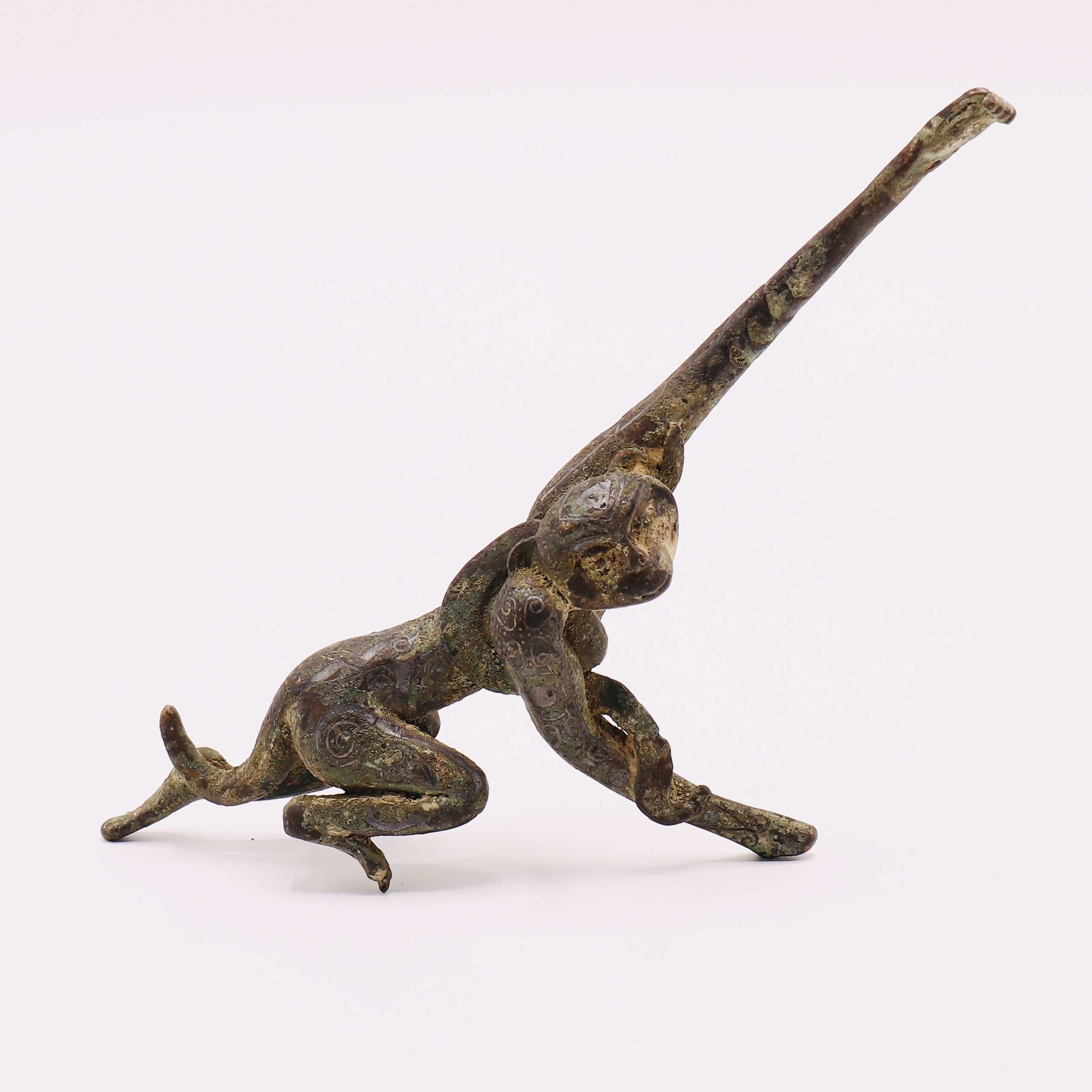 A VERY RARE CHINESE ARCHAIC BRONZE FIGURE OF A LEAPING MONKEY, WESTERN HAN DYNASTY (206 BC-AD 8)