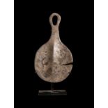 AN ANATOLIAN SILVER "MIRROR" EYE IDOL EARLY BRONZE AGE II, CIRCA 2700-2300 B.C.