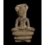 A KHMER SANDSTONE FIGURE OF A SEATED BUDDHA MUCHALINDA, BAYON STYLE, CIRCA 12TH-13TH CENTURY