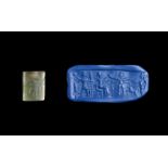 AN AMULET MITANNI GLASS CYLINDER SEAL, CIRCA 15TH CENTURY B.C. MESOPOTAMIA