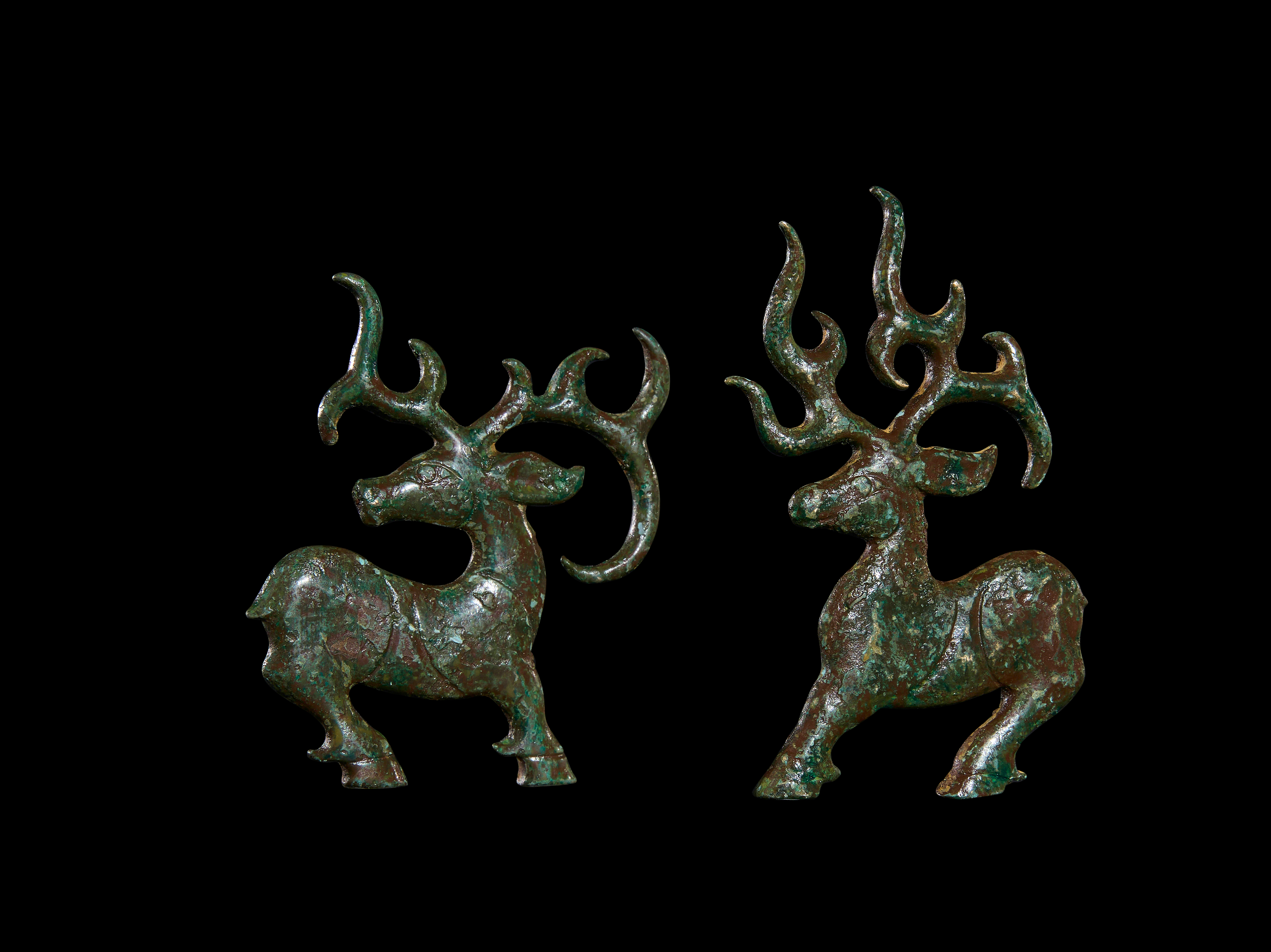 TWO LURISTAN BRONZE PARTS OF A HORSE BIT, CIRCA 9TH CENTURY