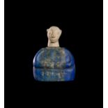 A BACTRIAN COMPOSITE LAPIS LAZULI SEATED PRINCESS