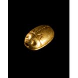 A SOLID GOLD EGYPTIAN SCARAB AMULET