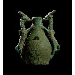 A LURISTAN BRONZE TWIN HANDLE IBEX VASE, CIRCA 9TH-7TH CENTURY B.C.