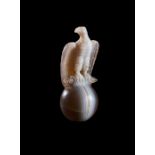 A HIGHLY RARE ROMAN SARDONYX SEATED EAGLE, IMPERIAL PERIOD CIRCA 1ST CENTURY A.D.