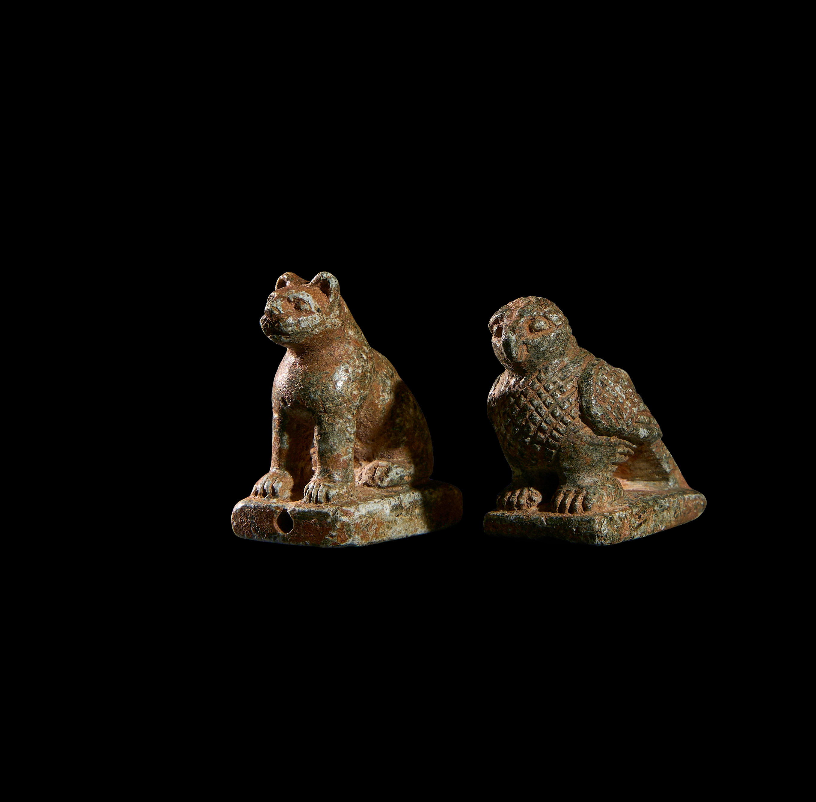 TWO CARVED STONE AMULETS OF A BIRD & FELINE, PROBABLY EGYPTIAN