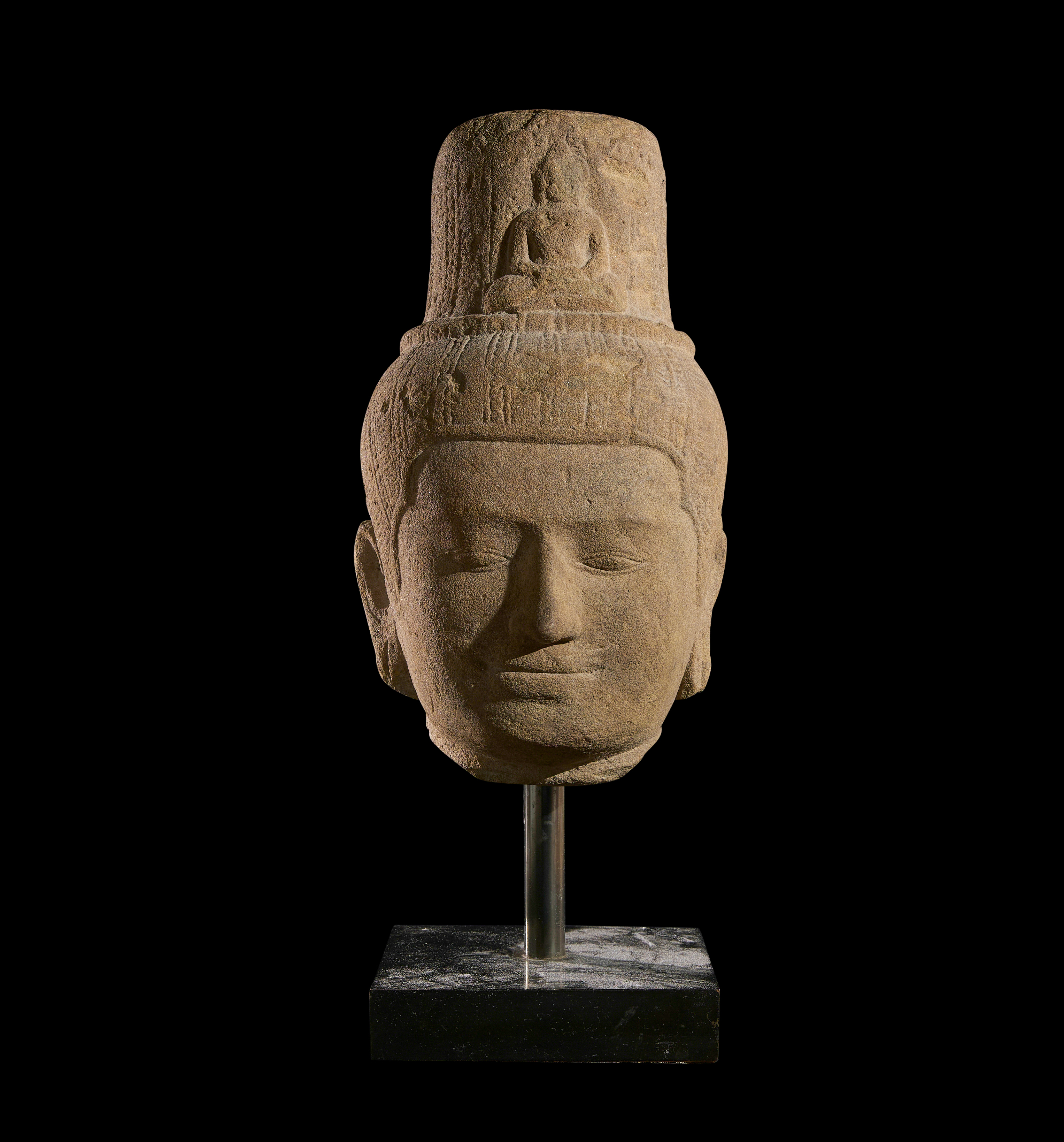A KHMER SANDSTONE HEAD OF LOKESHVARAM BAYON STYLE, CIRCA 12TH-13TH CENTURY